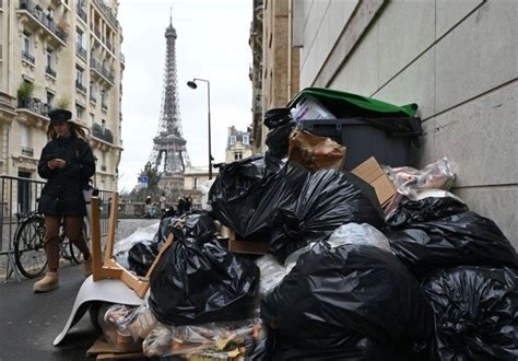 Paris trash strike ends, pension protest numbers shrink